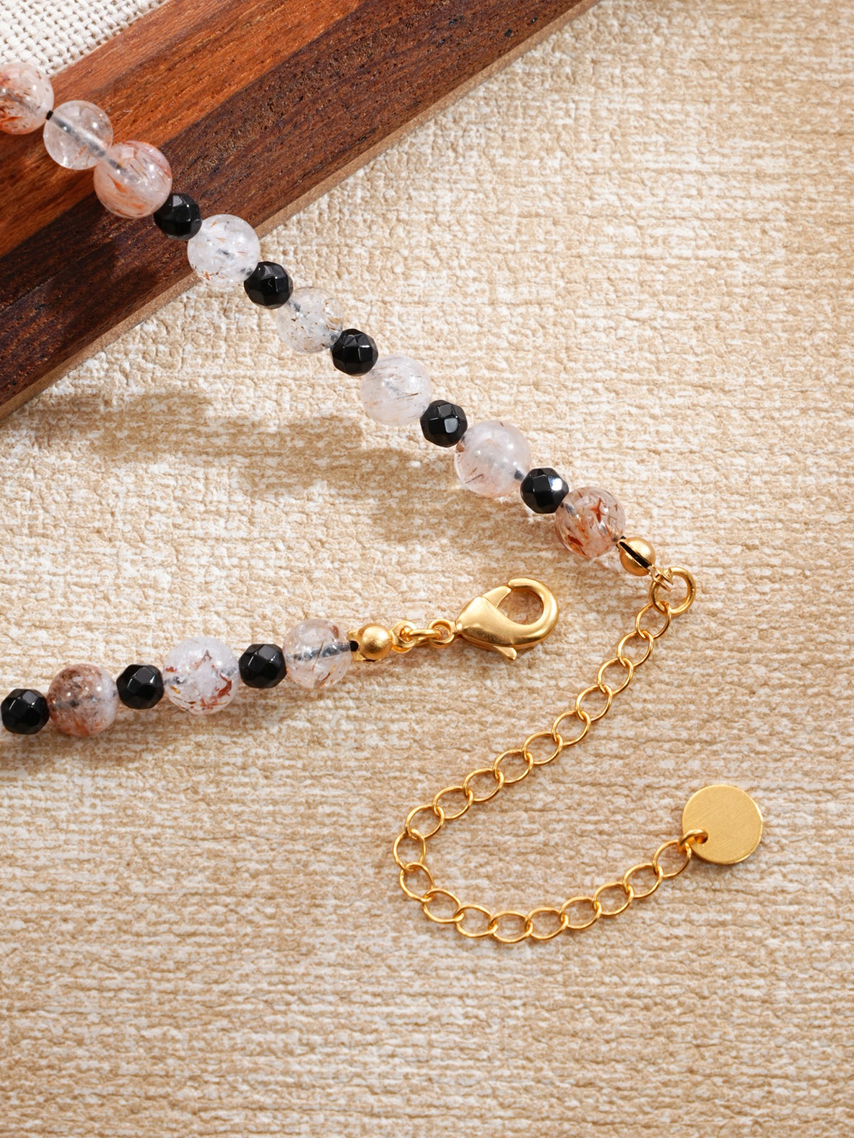 Gold-plated brass lobster clasp and extension chain detail, SKU 260854