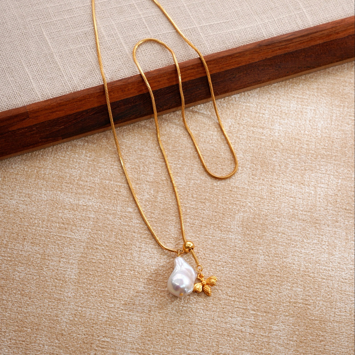 Miel gold plated baroque pearl lariat necklace editorial view