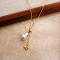 Miel necklace baroque pearl and bee charm detail